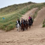Horseback riding through the dunes and on the beach